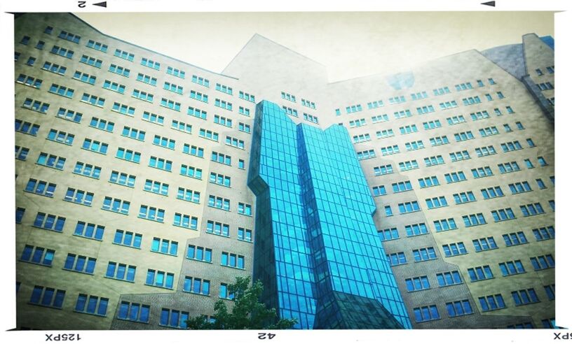 building exterior, architecture, built structure, city, low angle view, skyscraper, transfer print, office building, modern, auto post production filter, building, tall - high, tower, city life, day, tall, clear sky, outdoors, sky, residential building