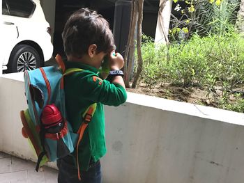 Boy standing outdoors