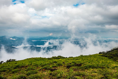 Scenic view of waterfall against sky