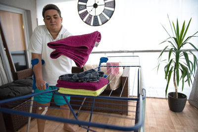 A disabled person washes laundry.