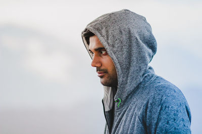 Portrait of young man looking away