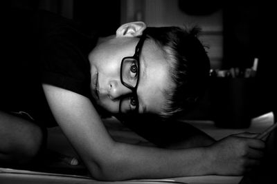 Portrait of boy with eyeglasses at home