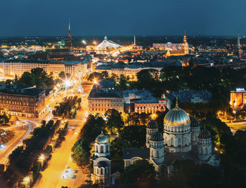 High angle view of illuminated buildings in city at night