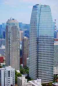 Modern buildings in city against sky