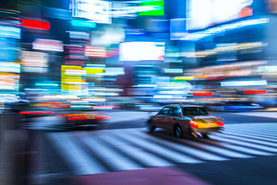 Blurred motion of car on road at night
