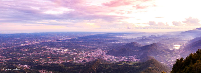Aerial view of cityscape against sky during sunset