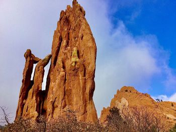 Low angle view of rock formation against sky