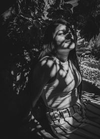 Portrait of beautiful young woman looking away