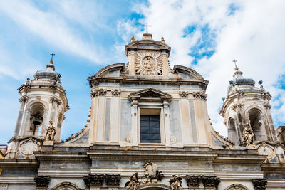 Low angle view of cathedral against cloudy sky