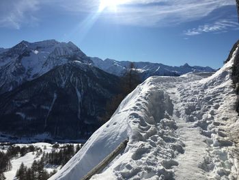 Scenic view of snowcapped mountains against sky