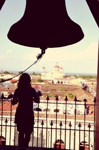 Woman standing in front of building