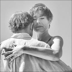 Portrait of mother and son against white background