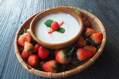 High angle view of strawberries in bowl on table