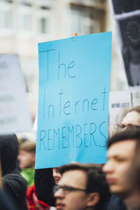 Close-up of woman with text