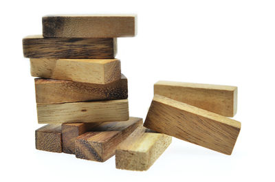 Stack of wood against white background