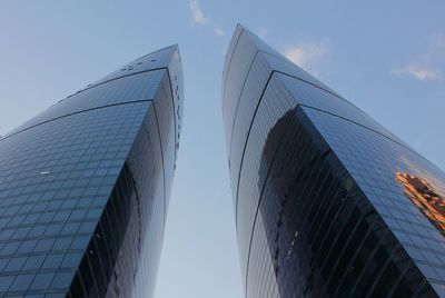 Low angle view of modern buildings against sky