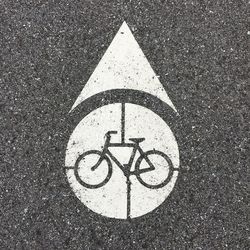 Directly above shot of bicycle symbol on road