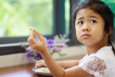 Portrait of cute girl sitting