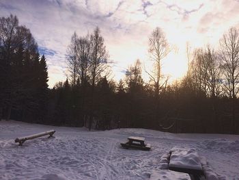 Scenic view of snow covered landscape against sky