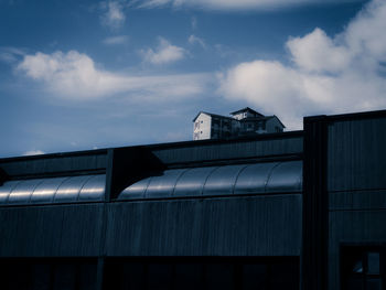 Low angle view of factory against sky