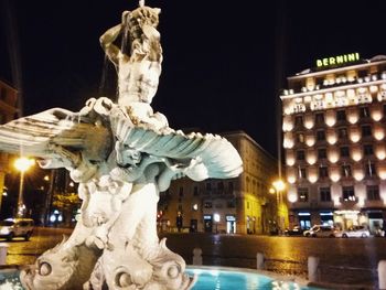 Low angle view of statue at night