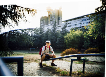 Full length of man sitting in park