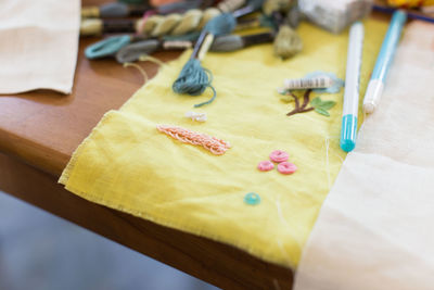 High angle view of sewing items on textile