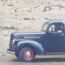 Vintage car parked on road