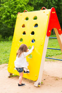 Low angle view of girl playing in playground