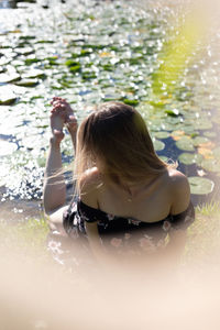 Rear view of woman in water