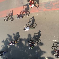 High angle view of people cycling on street