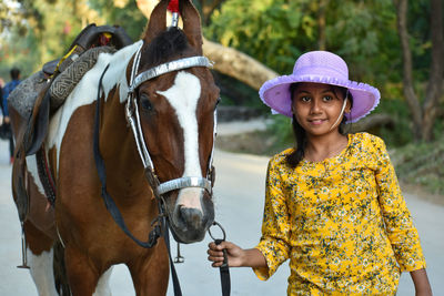 A teenage girl working with a horse