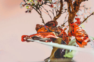 Low angle view of horse statue on flower tree