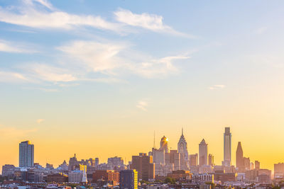 Cityscape against sky during sunset