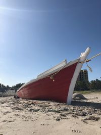 Lifeguard hut on beach against clear blue sky