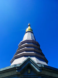 Low angle view of cross against blue sky