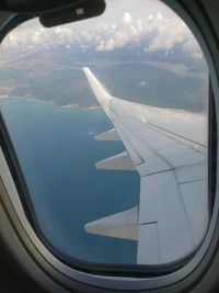 Airplane wing seen through window