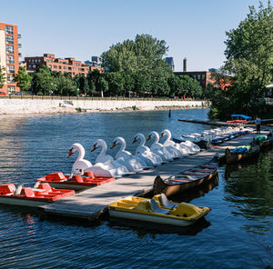 View of boats moored in river