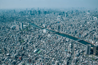 High angle view of city buildings against sky