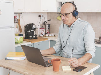 Mature man working at home