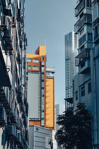 Low angle view of skyscrapers against sky