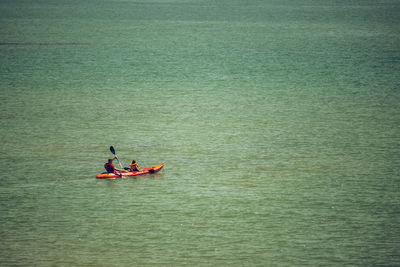 People kayaking on river