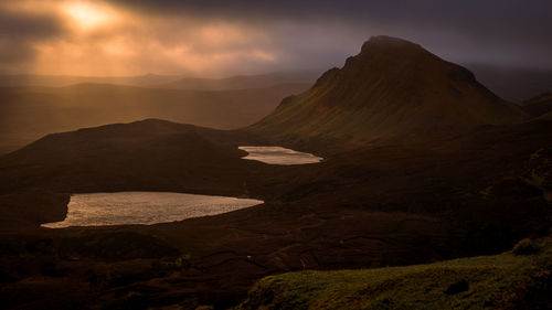 Scenic view of mountains against sky during sunset