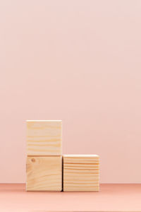 Stack of books on table against wall