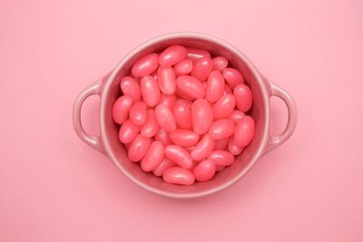 Close-up of red fruit over white background