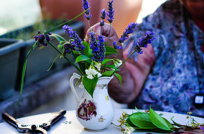 Close-up of woman holding flower bouquet