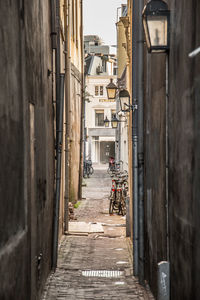 Narrow alley amidst buildings in city