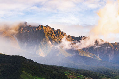 Panoramic view of sunlight falling on land against sky