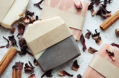 Spa setting witn natural handmade soap with cinnamon and flower petals