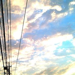 Low angle view of cloudy sky at sunset